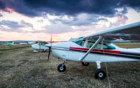small-private-airplanes-parked-airfield-scenic-sunset.jpg