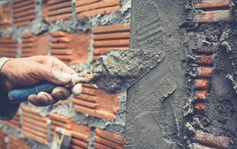 bricklaying-construction-worker-building-brick-wall.jpg