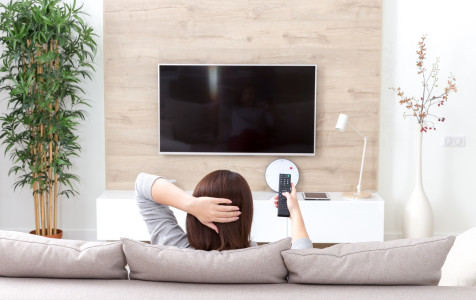 young-woman-watching-tv-room.jpg