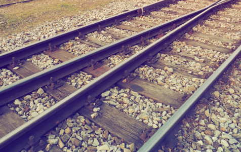 rails-sleepers-railroad-stones-railway-traffic-perspective-metal-rails-with-concrete-sleepers-closeup-retro-vintage-style.jpg