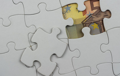 top-view-puzzle-pieces-with-money-it-concept-business.jpg