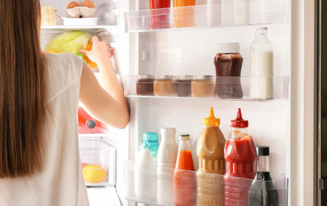 woman-choosing-food-refrigerator-home.jpg