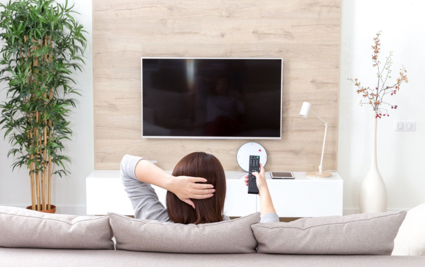 young-woman-watching-tv-room.jpg